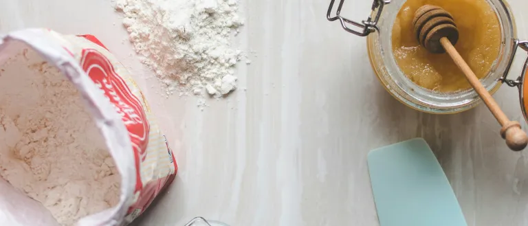 Wooden ladle and spatula on top of table