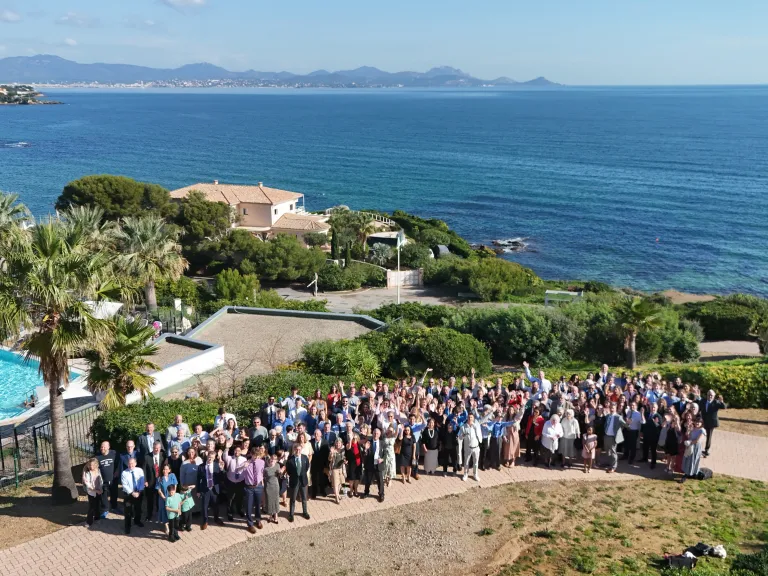 2024 Feast of Tabernacles Club Miléade La Gaillarde, France a large group of people standing outside the Mediterranean in the background