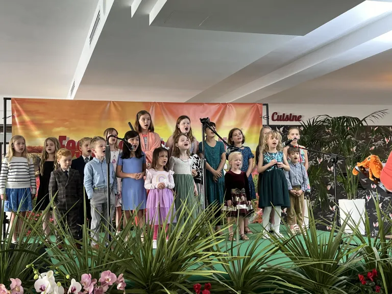 Feast of Tabernacles 2024 in Italy a group of children singing on a stage