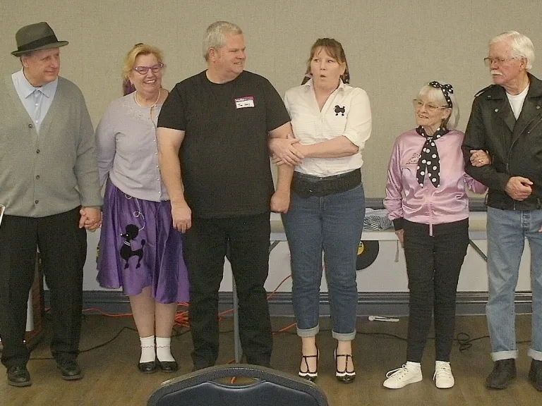 Contestants wore 50s attire for a church social event. six people in costume