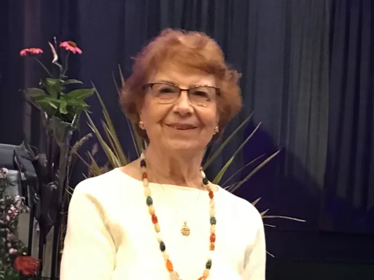 a woman wearing a necklace