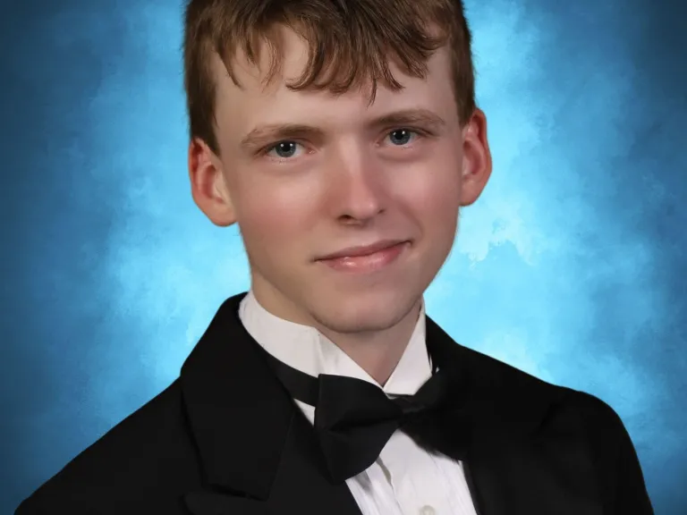 a young man wearing a bowtie