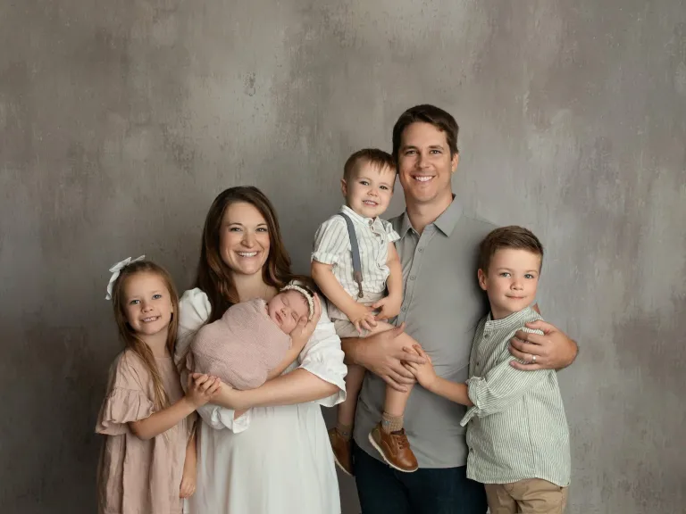 The Tomes family a mom, dad, three kids, and a baby