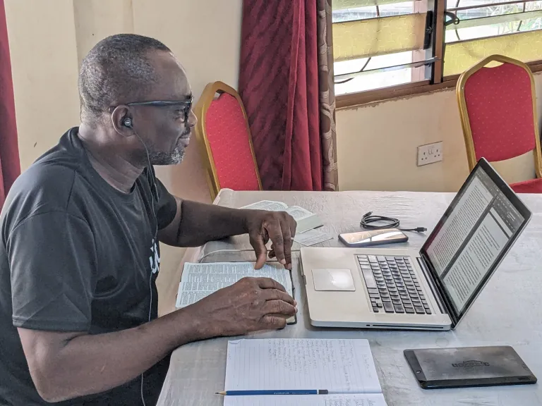 a man using a laptop on a table