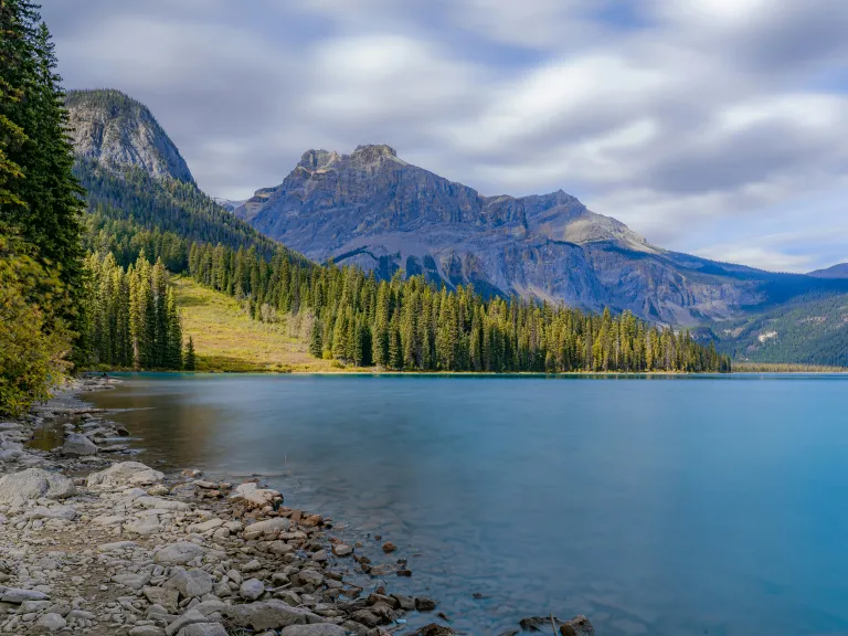 lake with mountains in the background