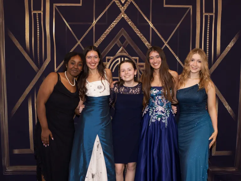 five teenage girls wearing prom attire