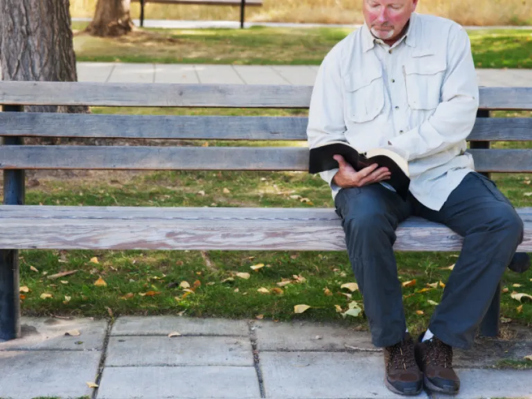 Jesus Christ observed the festivals God gave to ancient Israel. Christians, of course, are expected to follow His example, to "walk just as He walked" (1 John 2:6). A man reading a Bible sitting on a park bench.