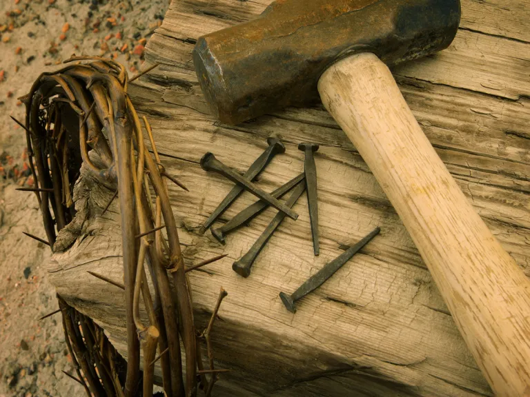 Jesus Christ was born and lived on earth for a little more than three decades. But why did He come? Few realize that ultimately there was no other option! An reenactment of the items used in Jesus Christ cruxifixion - crown of thorns, nails, hammer and stake.
