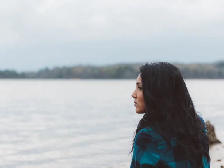 Here it is vital that we have pure, sincere hearts. We must truly desire to live according to God's instructions. A woman looking out over a lake.