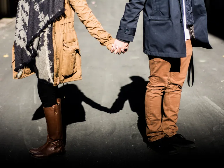 Sometimes being godly is the most challenging when you meet the person you plan to marry. A young couple holding hands while walking.