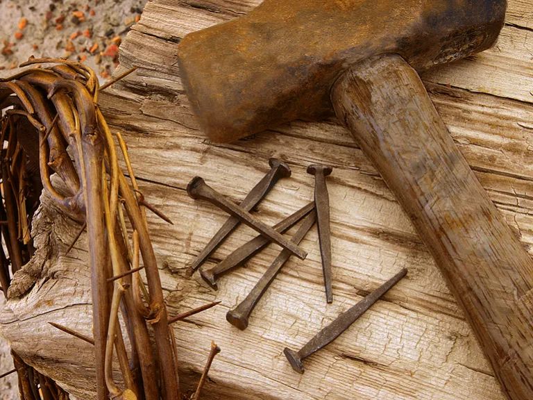 Crown of thorns, old nails and old hammer.