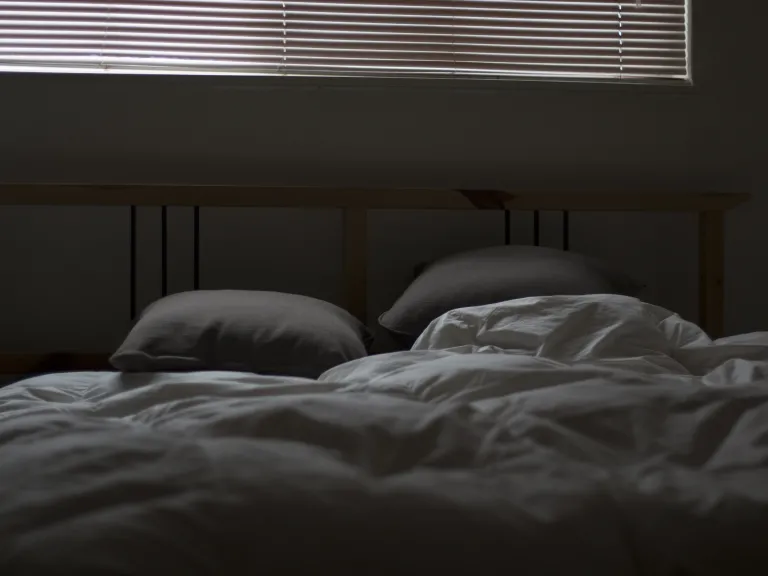 An bed that has been slept in.