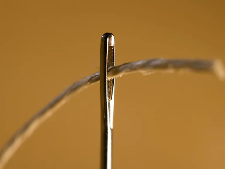 Just as it is impossible for a camel to go through the tiny eye of a needle, it is equally impossible for those who trust in riches, instead of in God, to enter the Kingdom of God. A thread going through the eye of a needle.