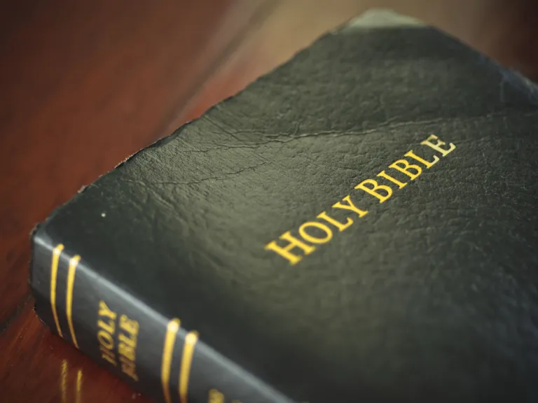 A Bible laying on a table.