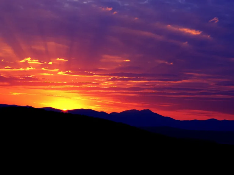 A sunset over a mountain ridge.