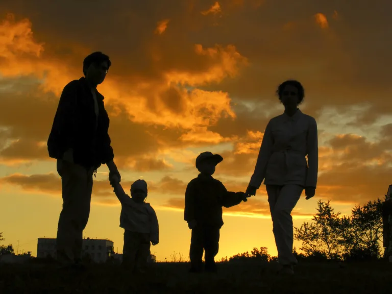 The human family was designed as a lesser model or type of the greater spiritual reality —that God is a family of which Jesus Christ is the “firstborn among many brethren.” A silhouette of a family of four.