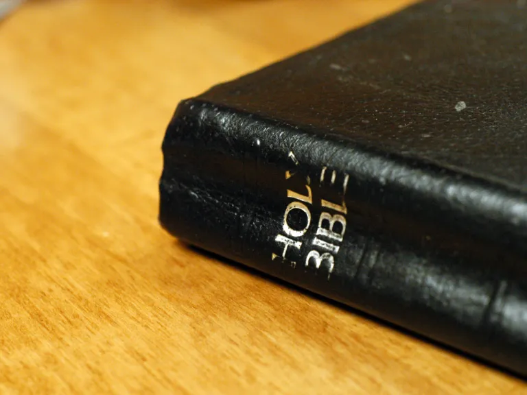 The book of Hebrews is most emphatic that Jesus is God. A Bible laying on a table.