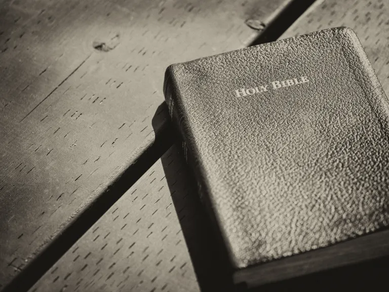 Bible laying on top of a table