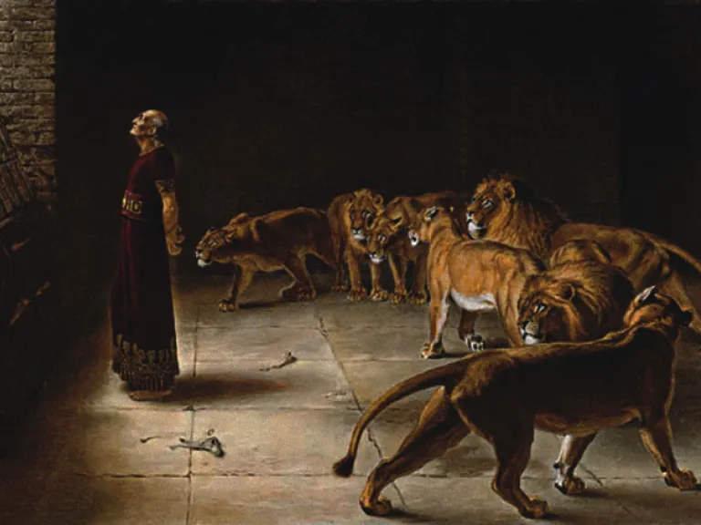 Angels provided physical protection to the prophet Daniel, closing the mouths of lions that otherwise would’ve killed him. An artist's rendition of Daniel in the lion's den.