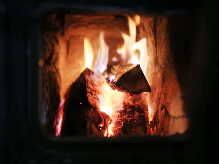 God does not forbid you a fire to warm your homes on a cold Sabbath night, nor a cooking fire, nor the lighting of a lamp in the dark. A fire burning inside a wood stove.