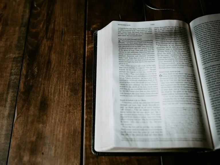 A Bible opened to the book of Romans