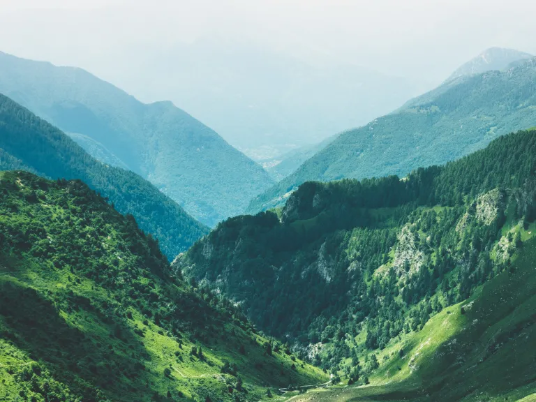 Photo of valley surrounded by mountains.