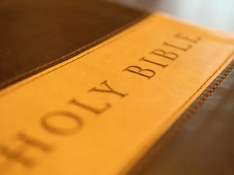 Bible laying on top of a table