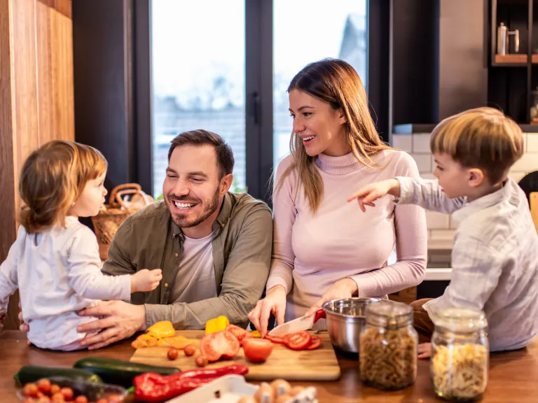 A family in the kitchen.