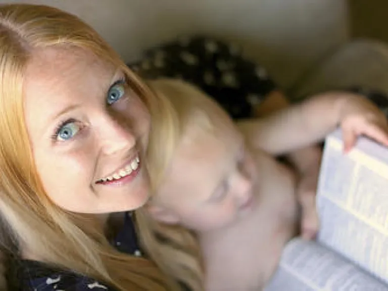 Mini-Bible Study: Crucial Lessons From Knowing God as Our Creator A young mother holding a Bible and reading the Bible.