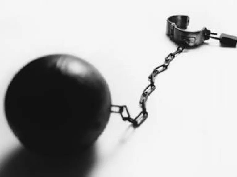 The Binding of Satan Pictured on the Day of Atonement Ball and chain with hand cuff.