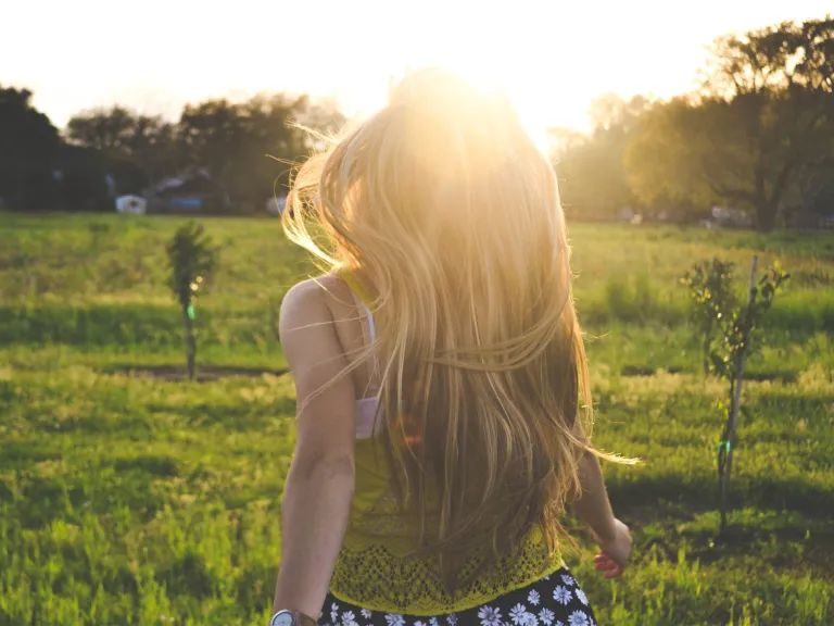 Joy is largely composed of gratitude— gratitude for the wonderful things God has done for us and His “exceedingly great and precious promises” for our future. A young woman running in a field.