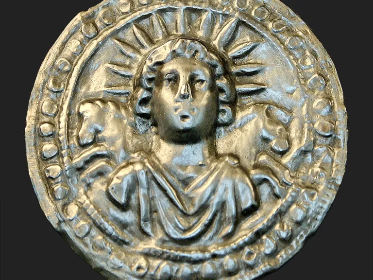This ancient Roman silver disk depicts Sol Invictus, the Roman sun god whose birthday was celebrated annually on Dec. 25—the date later adopted for the Christmas holiday. Ancient Roman silver disk depicts Sol Invictus