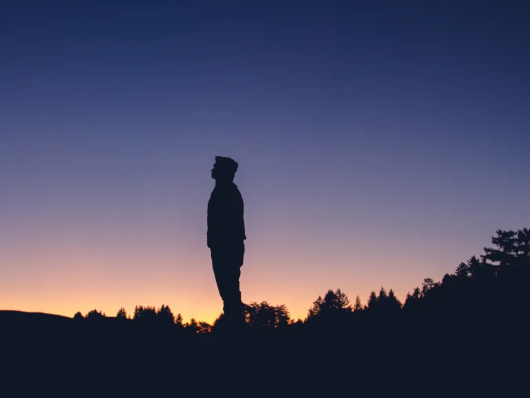 A man looking up at the stars.