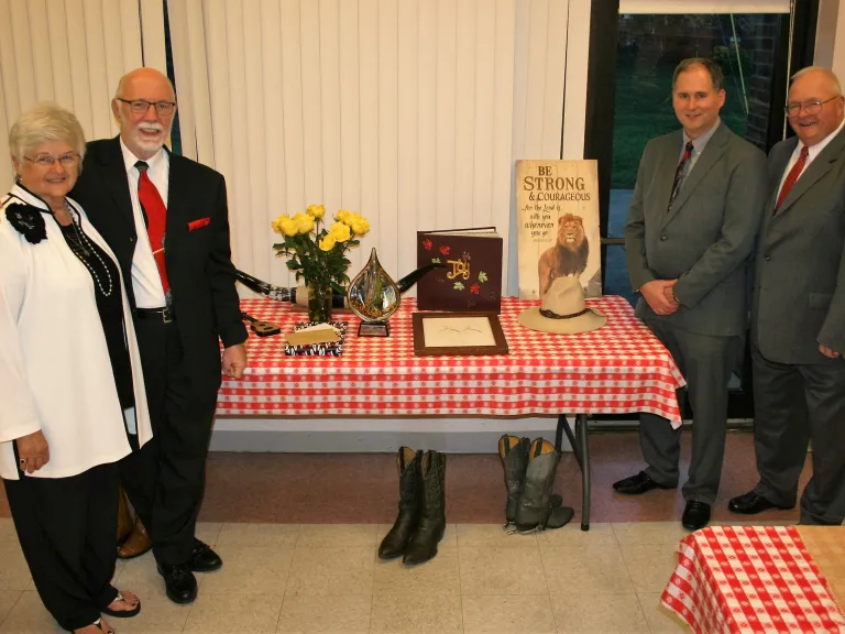 The McCradys (on the left) with Ron Barker and Dave Hemsley (on the right) who presented the gifts to the McCradys. The McCradys (on the left) with Ron Barker and Dave Hemsley (on the right) who presented the gifts to the McCradys.