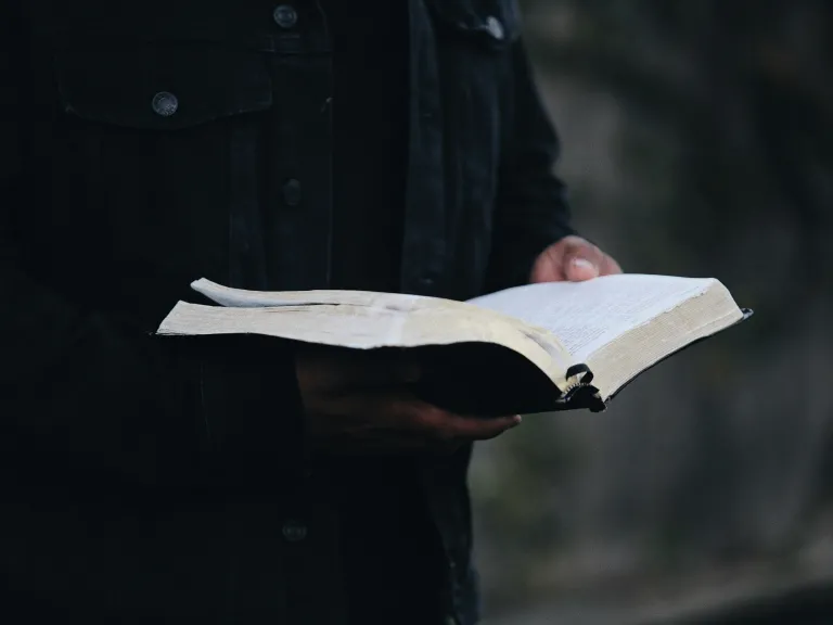 No other religion compares to the true covenant relationship God offers—marked by His astounding mercy, eternal promises, and the selfless sacrifice of Jesus Christ for those who choose to follow Him. A man holding an open Bible.