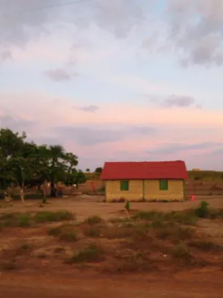 Red and yellow house in farmland