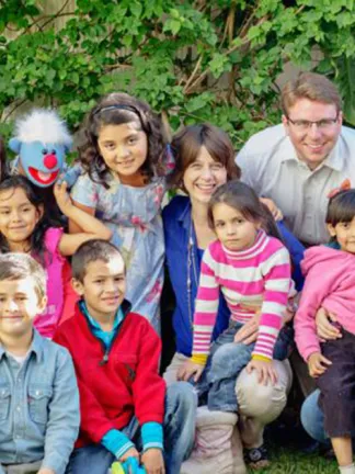 Children, volunteers, and Jelly at Eagle's Nest Orphanage