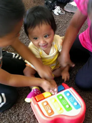 Children playing with a musical toy