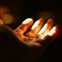 Hand extended in the sunlight
