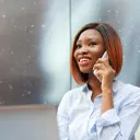 a woman holding a cell phone to her ear