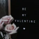 A sign that says. "Be My Valentine".