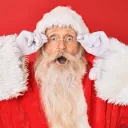 Santa Claus looking surprised against a red background
