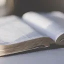 An open Bible on a table.