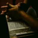 A person with an open Bible on their lap.