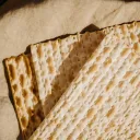 three matzos sitting atop a piece of cloth
