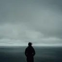 A person looking out at a body of water.