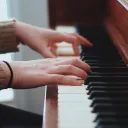 Playing piano.