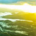 A sun glare over a valley.