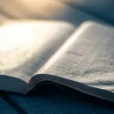 An open Bible on a table.