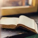 A Bible laying on a table.